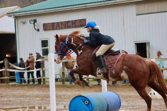 girl jumping horse
