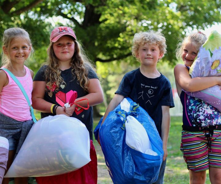 Campers with pillows and sleeping bags