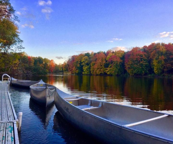 canoes on lake in fall