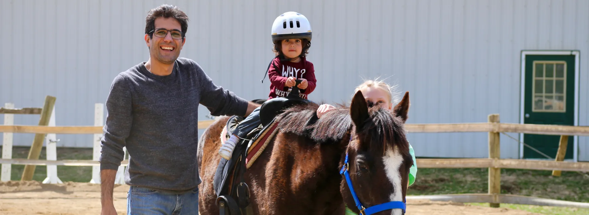 Dad and daughter on horse